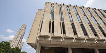 Hillman Library exterior with Cathedral of Learning in background