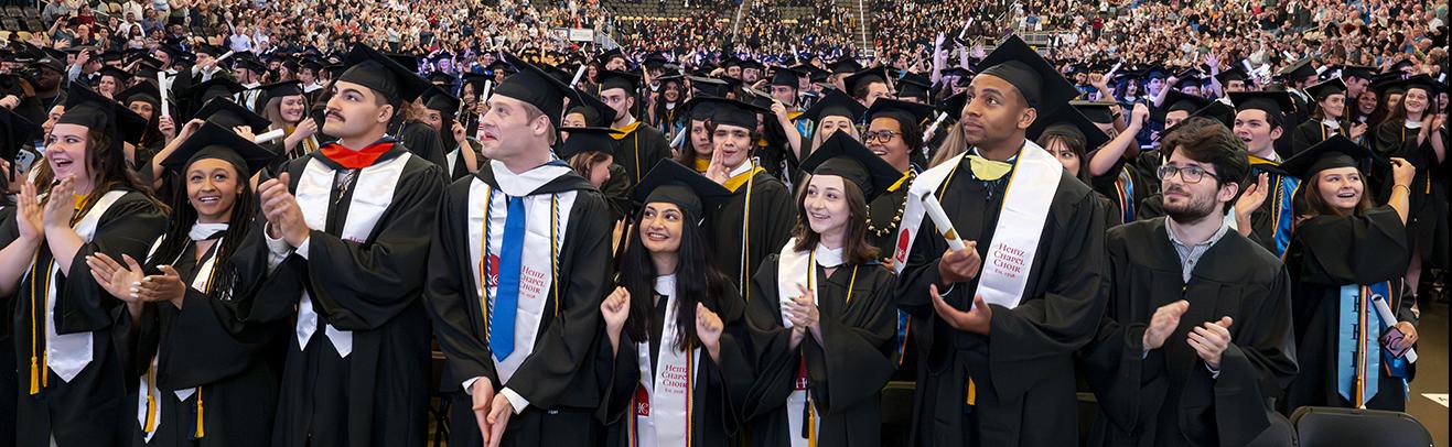 New graduates celebrate at end of 2025 commencement ceremony.